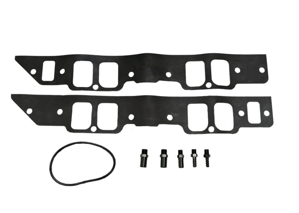 A set of automotive gaskets and bolts laid out on a white surface.