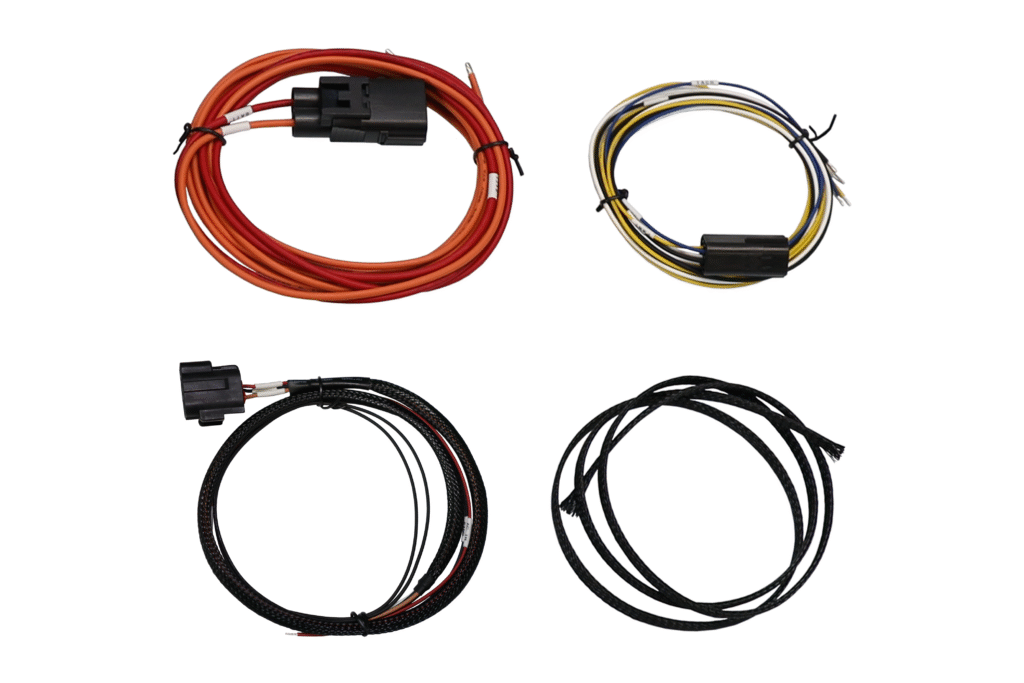 Set of four electrical wiring harnesses with connectors in various lengths.