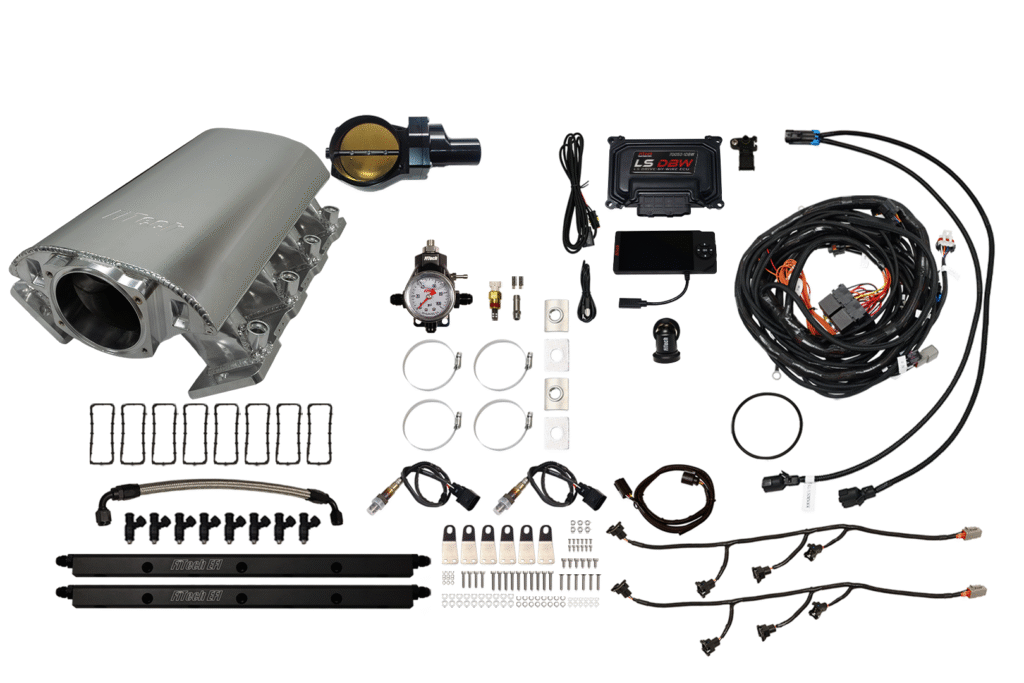 A complete fuel injection system kit with various components and wiring.