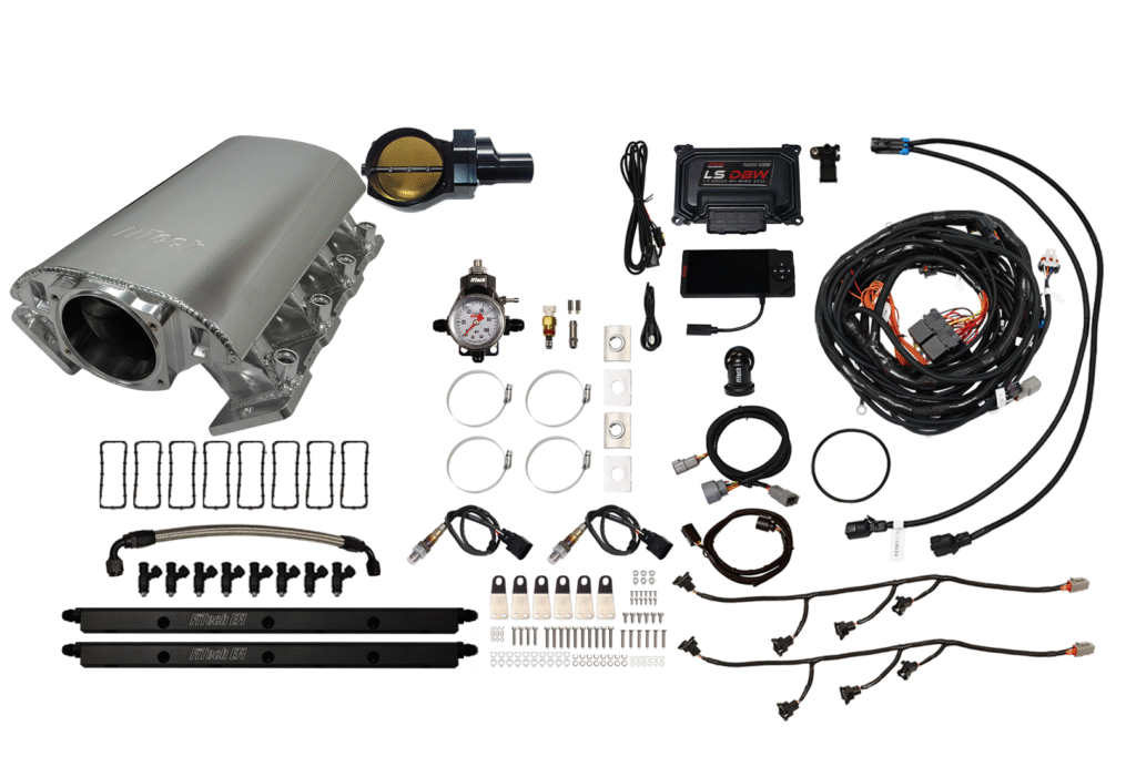 Complete automotive fuel injection system with components and wiring.