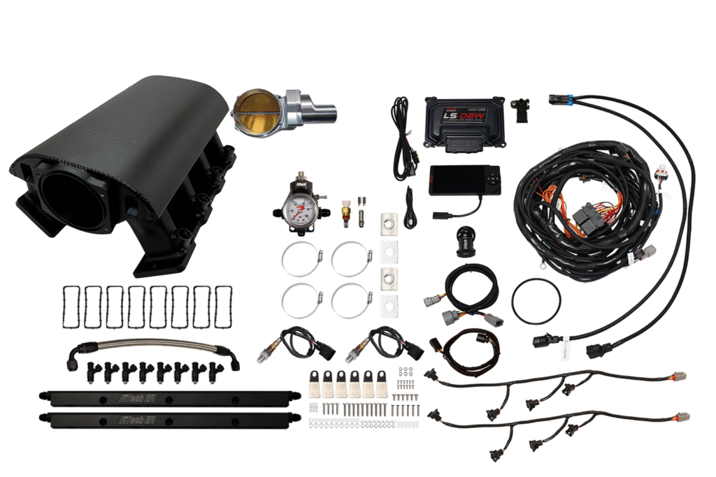 Components of an automotive air suspension system laid out on a white surface.