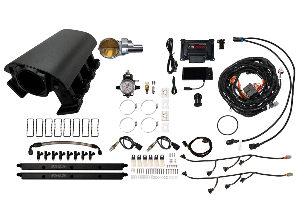 A disassembled automotive turbocharger kit with various components.