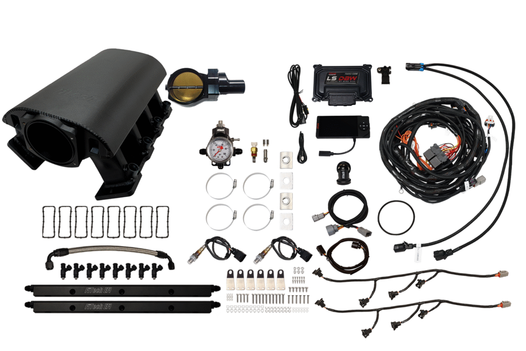 Complete automotive wiring and control kit with connectors and modules.