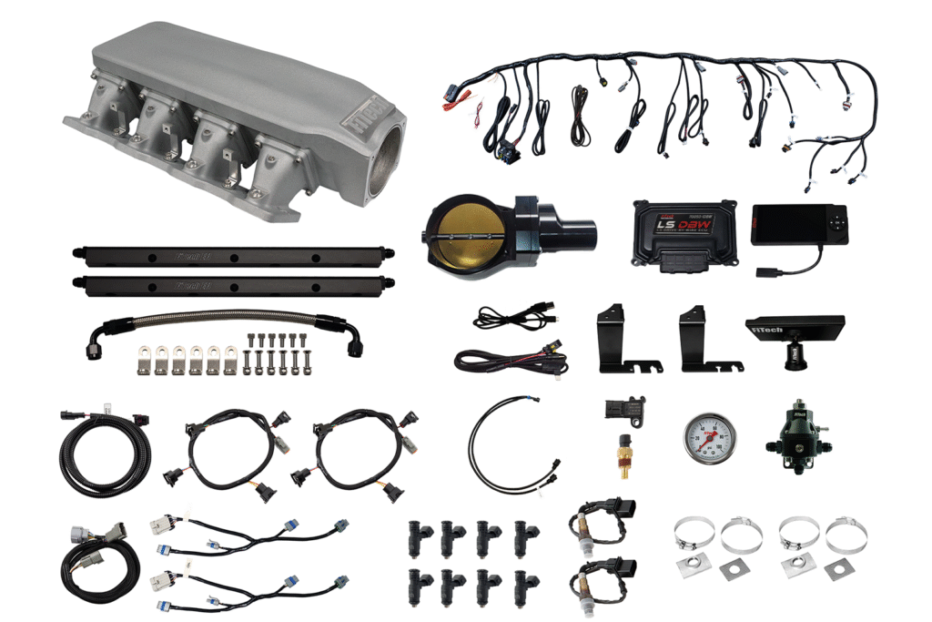 Various car alarm and security system components laid out on a white background.
