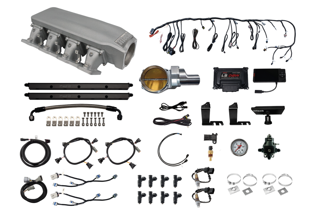 An organized assortment of automotive wiring and electronic components.