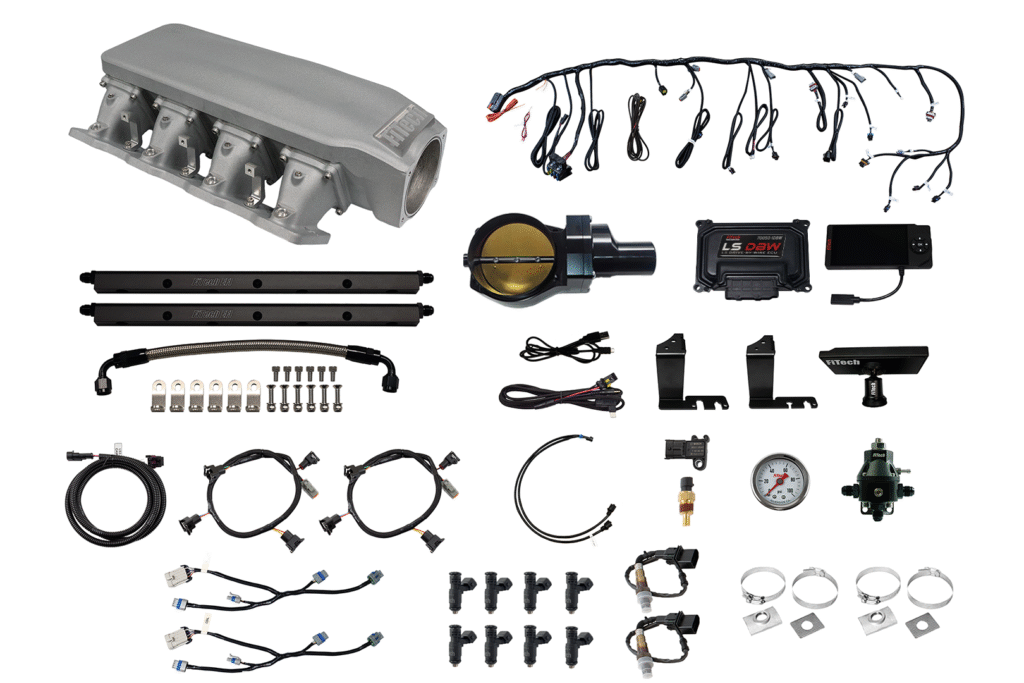 Various automotive electrical components and wiring harnesses laid out.