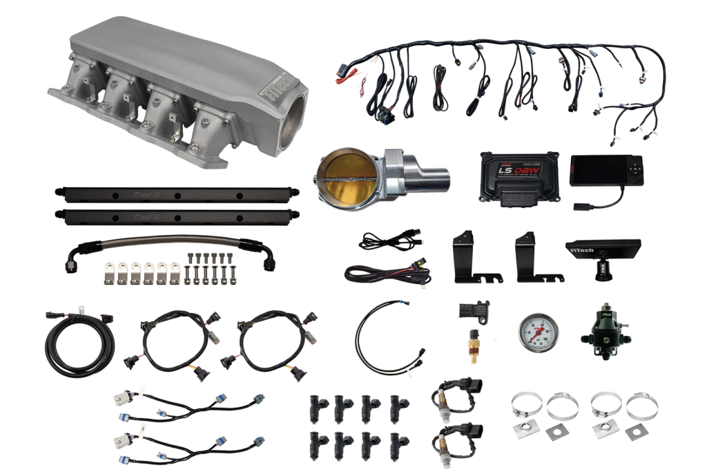 Various electronic and mechanical parts laid out on a white background.