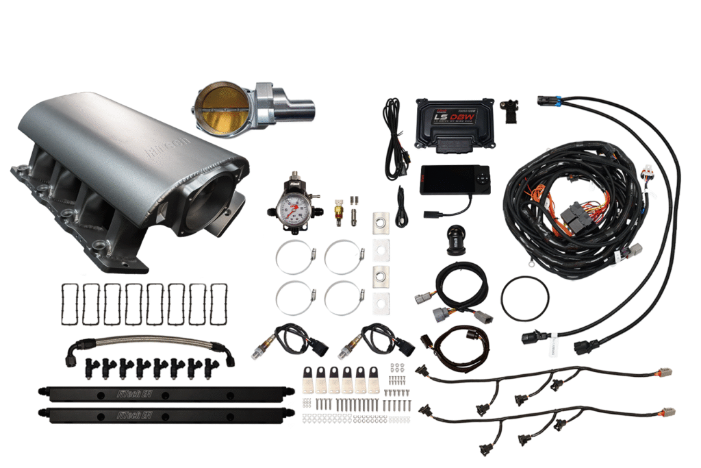 Car turbocharger kit with various components and wiring.