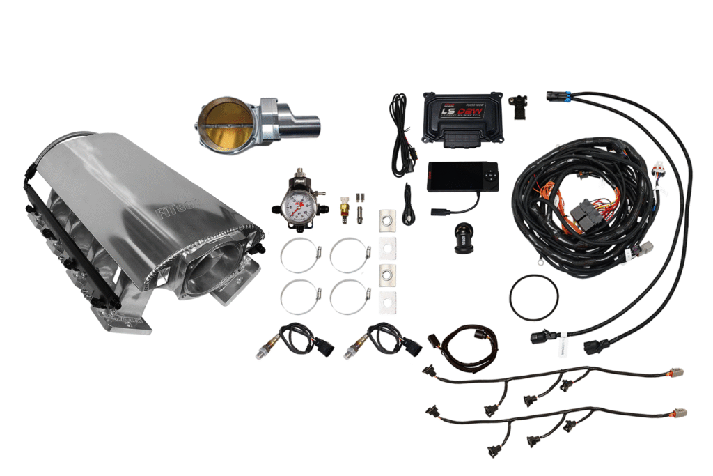 A car engine and various automotive parts laid out.