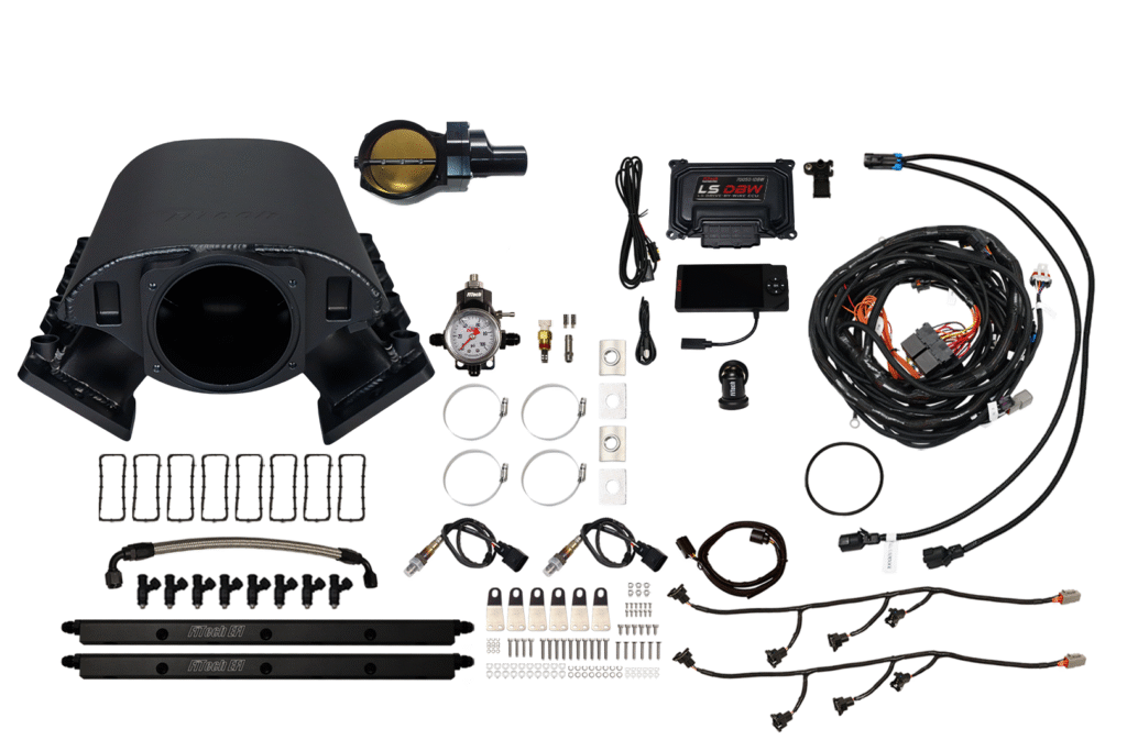 Complete car turbo kit with various components and wiring.