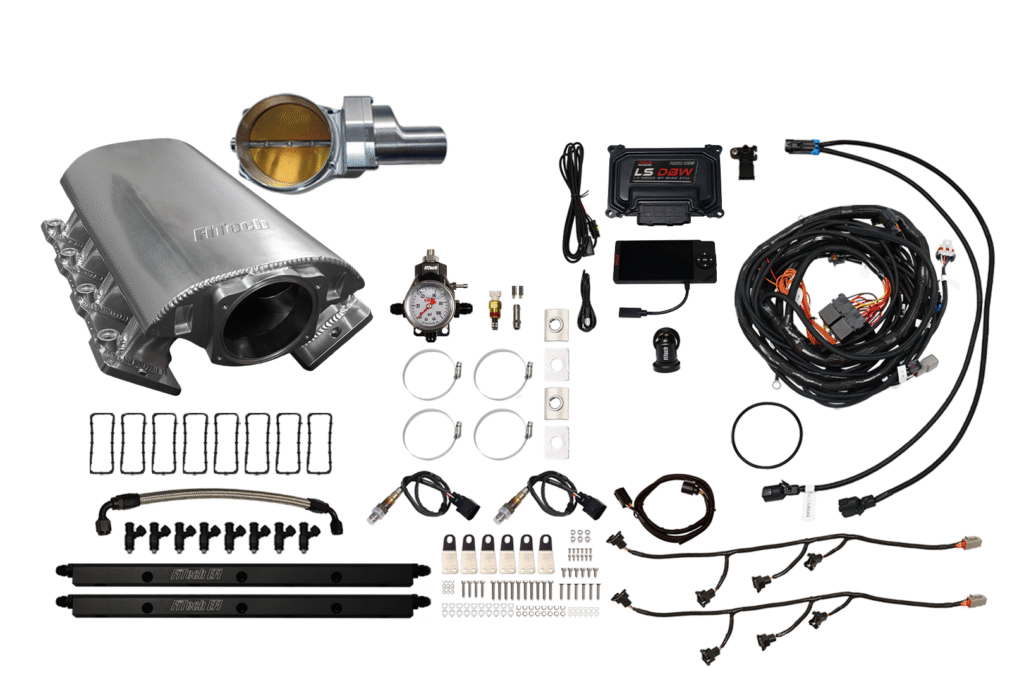Car exhaust system and engine tuning parts laid out on a white background.