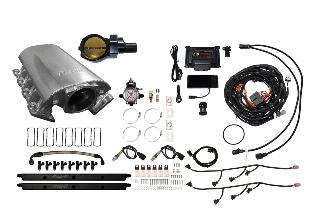 Complete car exhaust system kit with various components and wiring.