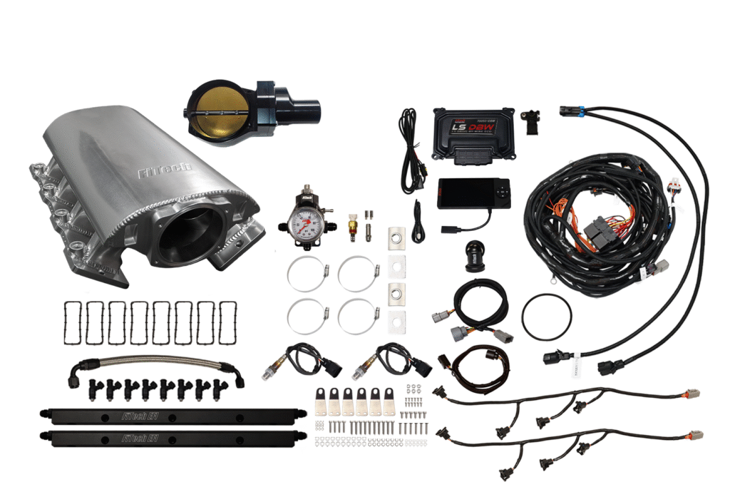 Comprehensive car turbo kit with various components and wiring.