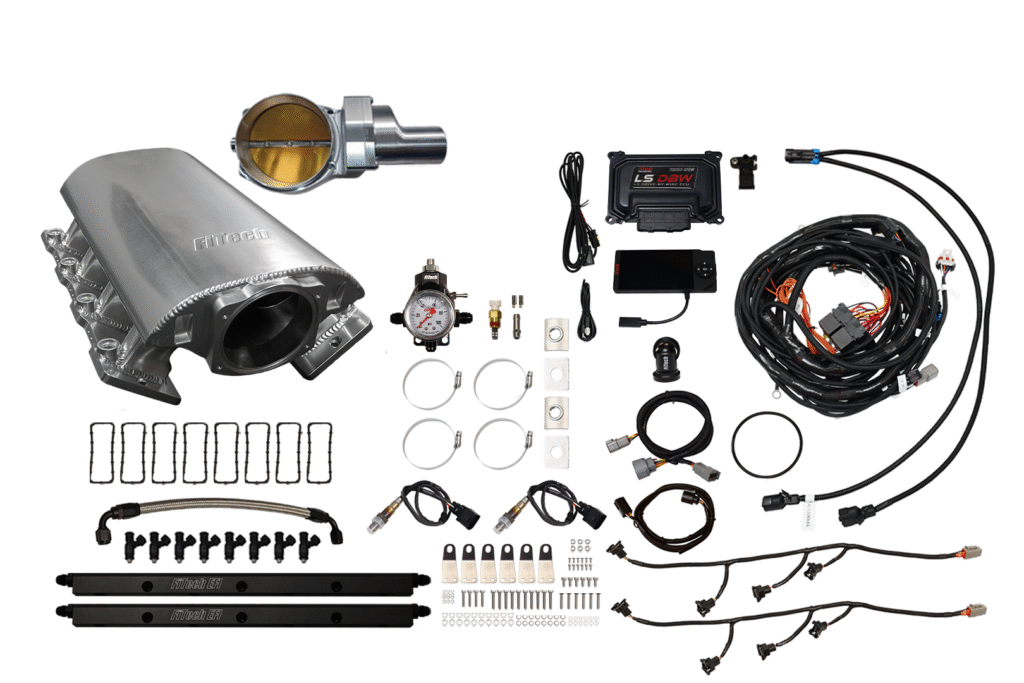 A collection of automotive parts and wiring components laid out on a white background.
