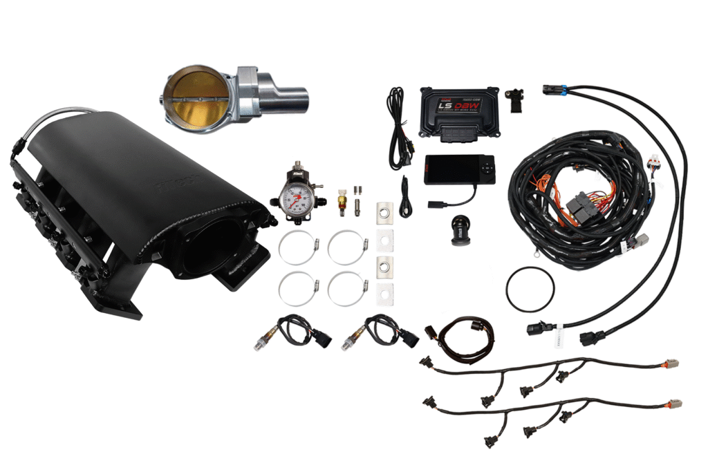 Car turbocharger kit with various installation components and wiring.