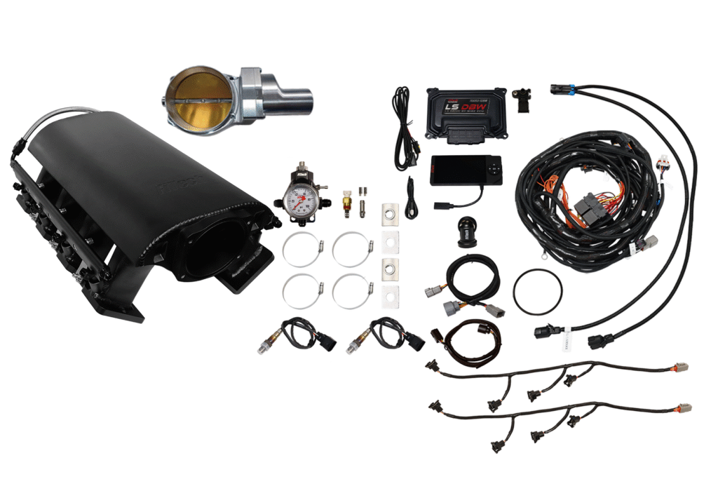 Components and wiring for a car turbocharger system laid out.