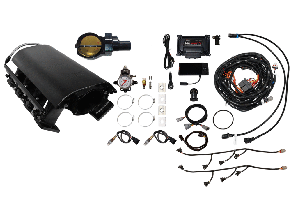 A car turbocharger kit with various parts and wiring components.