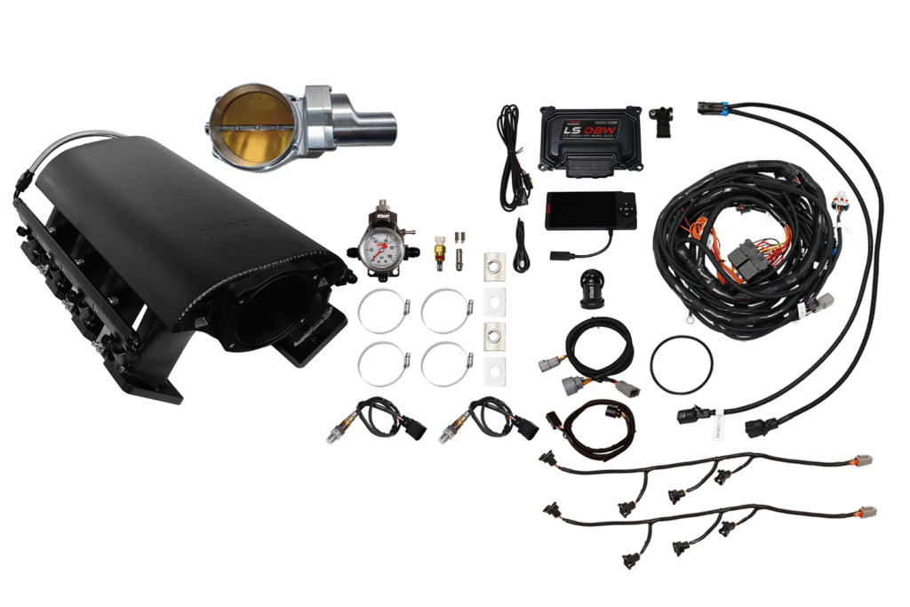 Car turbocharger kit with various installation components laid out.