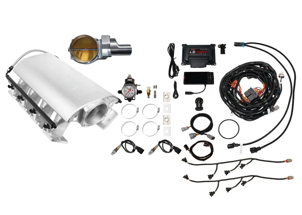 Components of a vehicle alarm system laid out on a white surface.