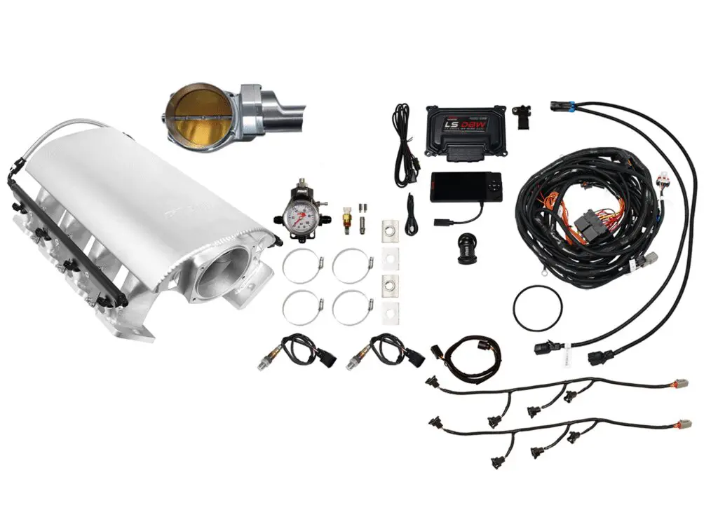 Car turbocharger and related installation components laid out on white.