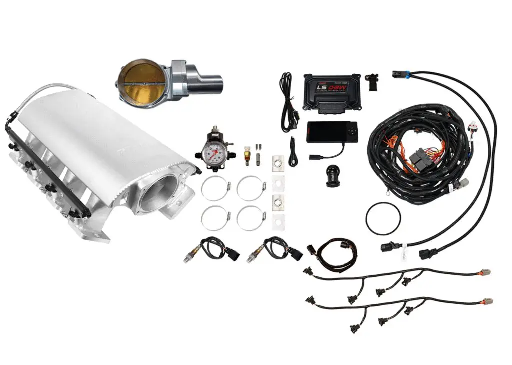 Complete car engine turbo kit with various components laid out.