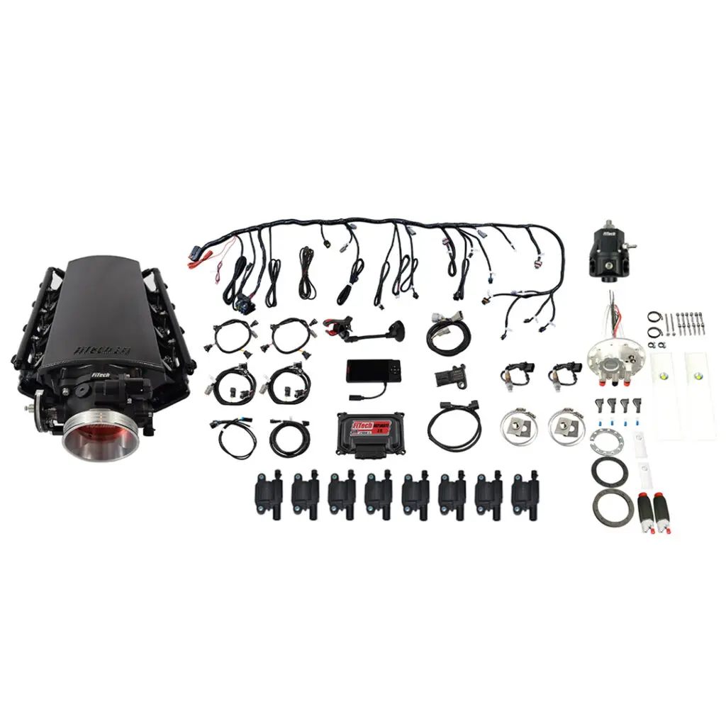Car supercharger kit with various components laid out.