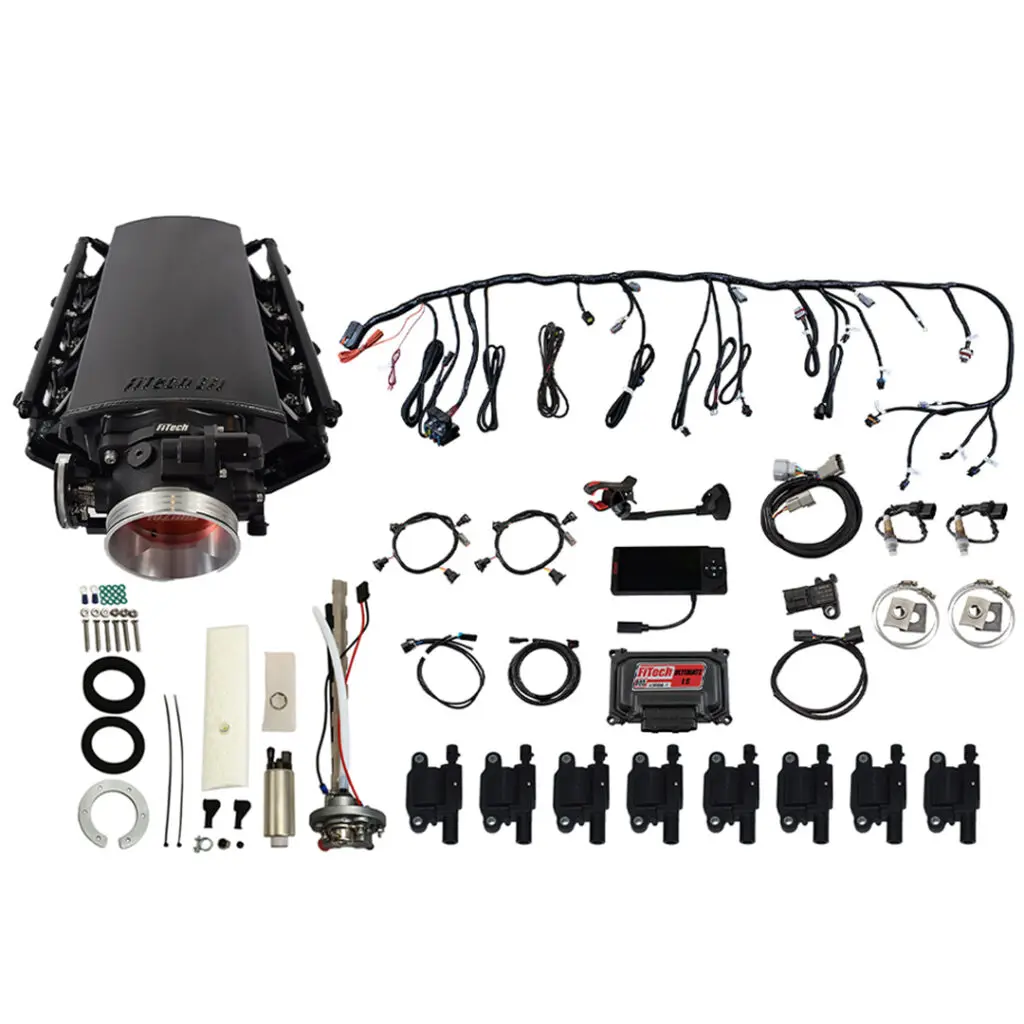 Complete car engine intake manifold kit with components and wiring harness.