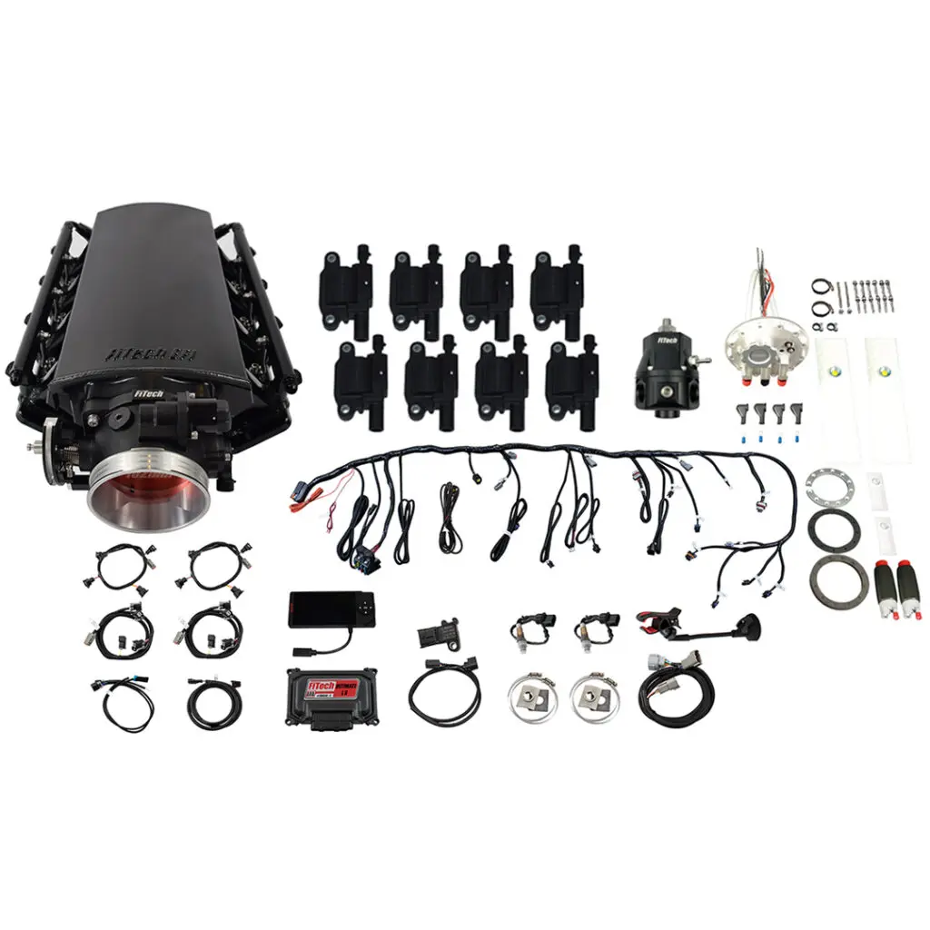 Complete automotive engine intake manifold kit with sensors and wiring.