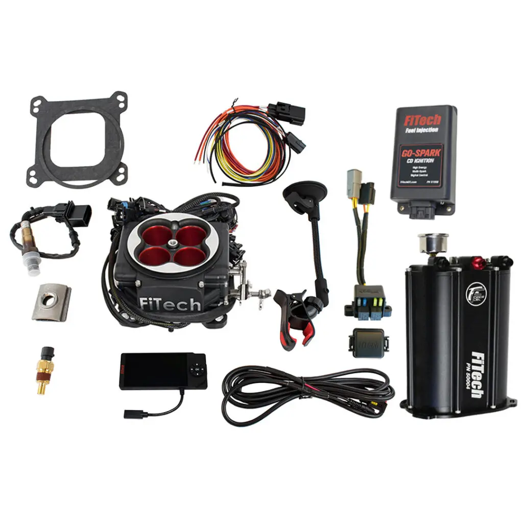 Complete automotive electronic fuel injection kit with throttle body and wiring components.