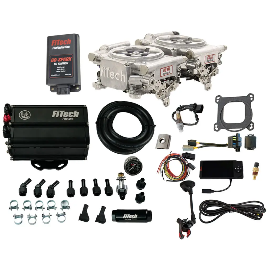 Complete automotive carburetor rebuild kit with various parts and gaskets.