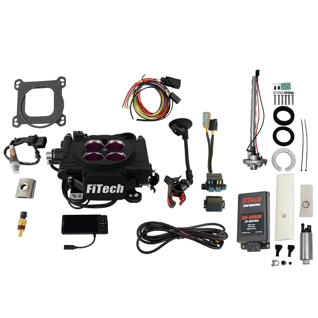 Complete car engine intake kit with manifold and accessories.