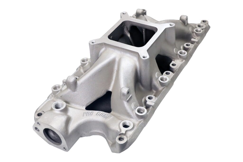 Silver automotive engine intake manifold isolated.