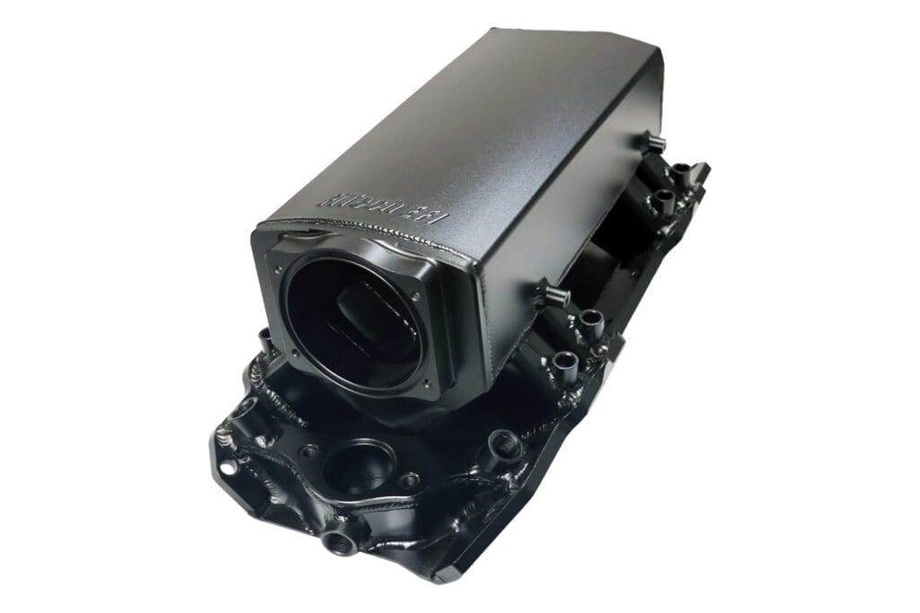 Black metal automotive engine cover component.