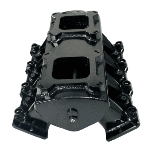 Black automotive intake manifold isolated on white background.