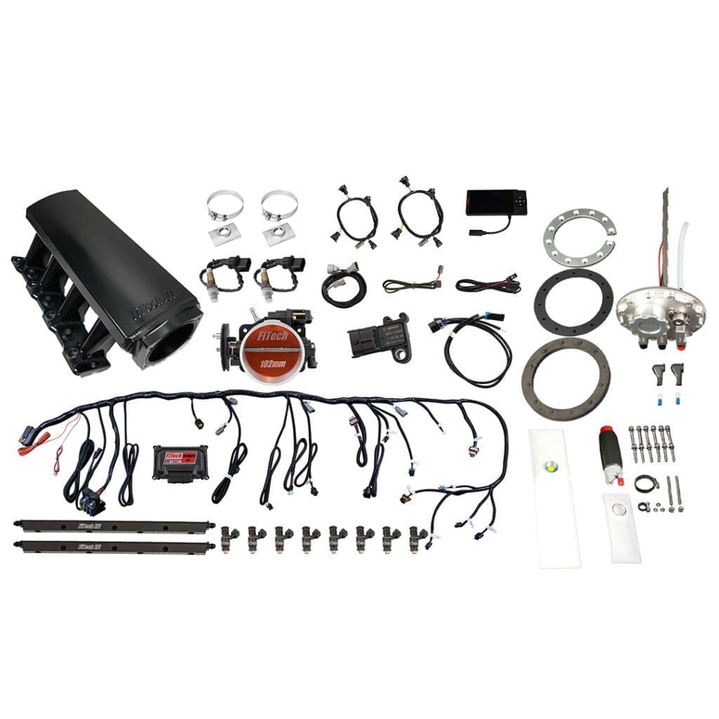 Car engine parts and accessories laid out.