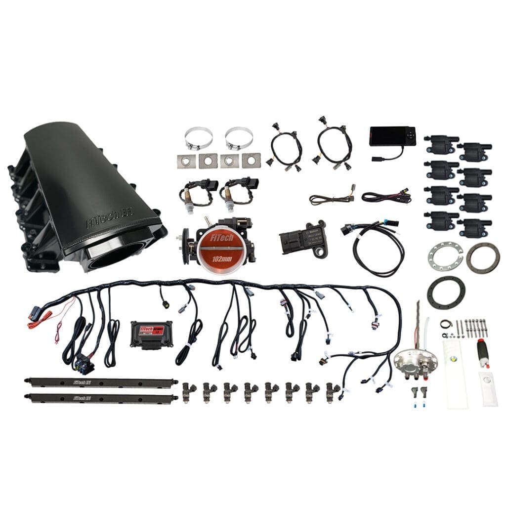 Car engine parts kit arranged neatly.