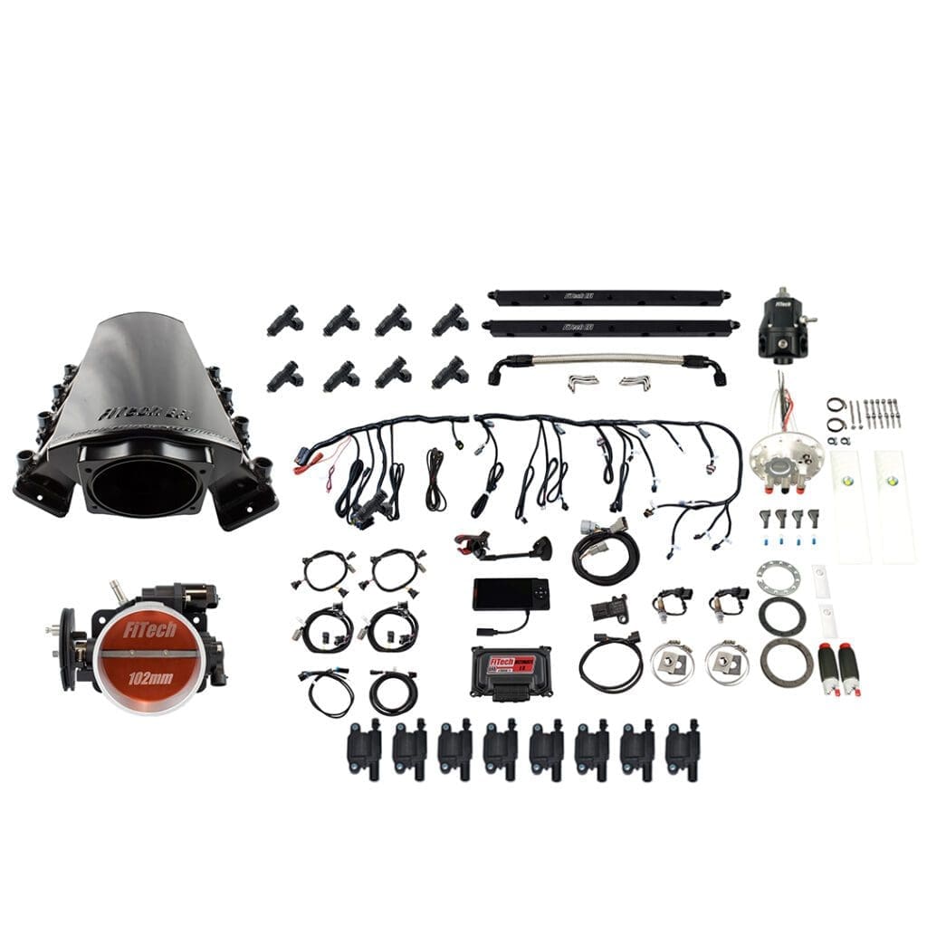 Car engine components laid out on white background.