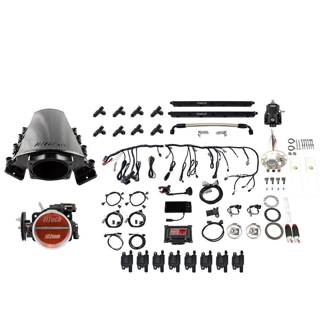 Car engine components laid out on white background.