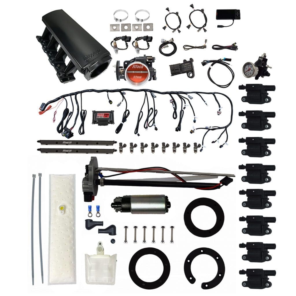 Car engine parts and accessories laid out.