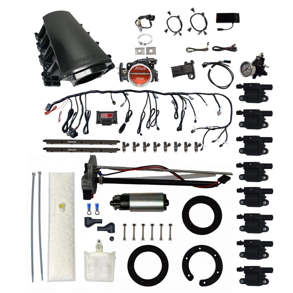 Car engine parts and wiring components displayed.