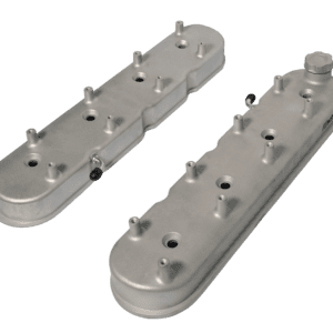 Silver engine valve covers on black background.