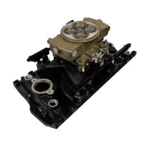 Carburetor on black intake manifold, isolated.