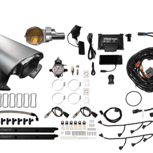 Car engine parts and wiring components laid out.