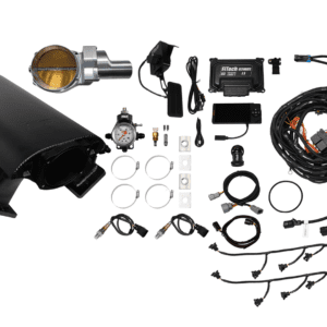 Car engine components and wiring kit laid out.