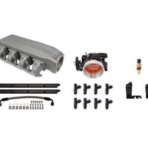 A car engine intake manifold kit with various components laid out.