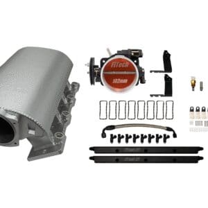 A silver car engine component with a red ignition distributor and various accessories.