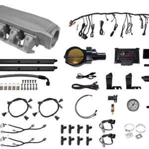 Various automotive electrical components and wiring harnesses laid out.