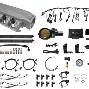 A collection of automotive parts and wiring harnesses laid out on a white background.