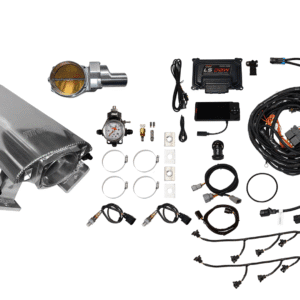 A collection of automotive parts and wiring components laid out on a white surface.