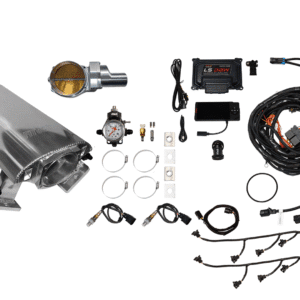 A car engine and various automotive parts laid out.